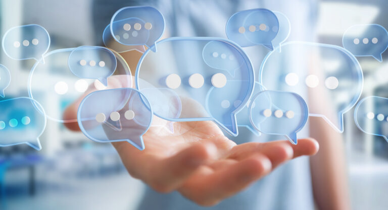 Businessman using digital speech bubbles talk icons. Minimal con