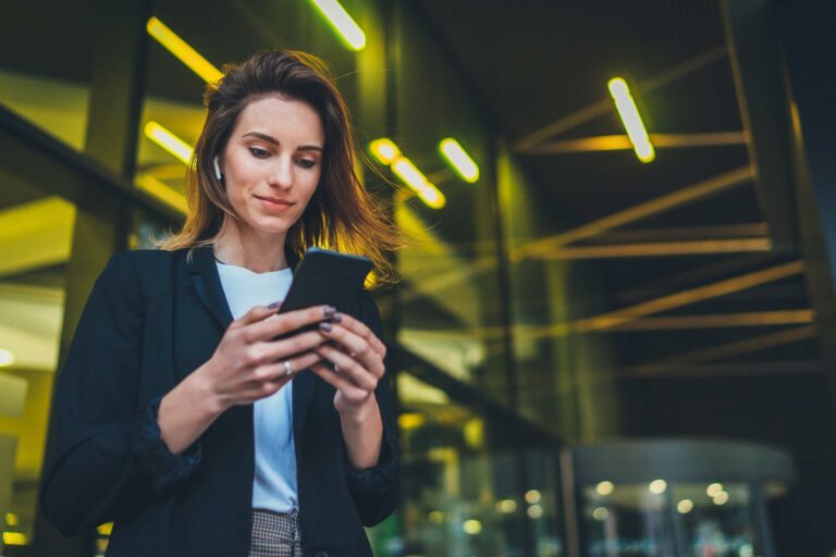 Woman looking at mobile alert