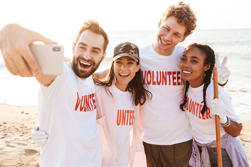 Group of happy young friends volunteers making a selfie|Group of happy young friends volunteers making a selfie|Team teamwork business join hand together concept