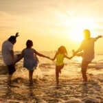 happy family enjoy summer vacation on the beach