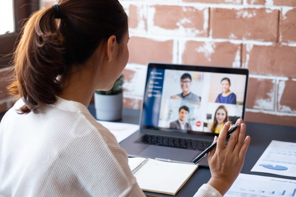 Businesswoman at home and attending a webinar.