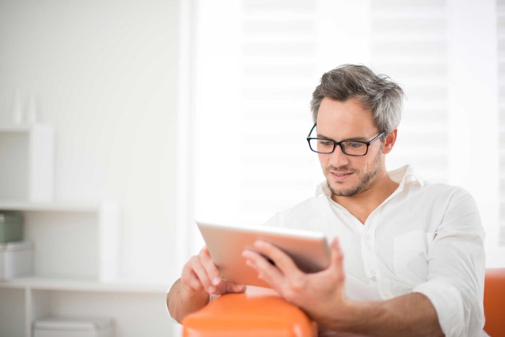 Man reading blog post on tablet