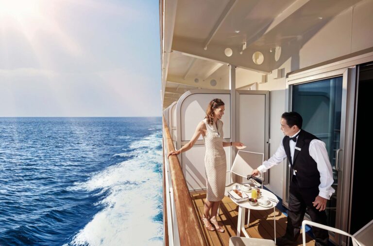 Lady on the balcony of her Veranda Suite, Silver Muse