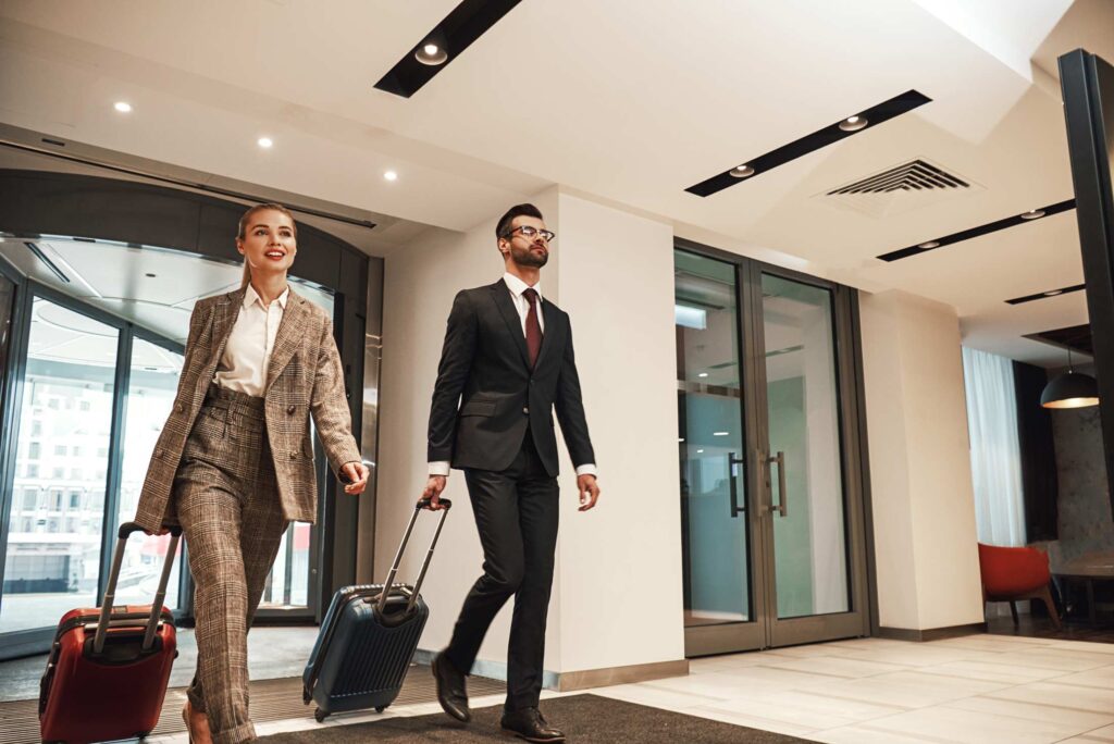 Businesspeople checking in at a hotel.