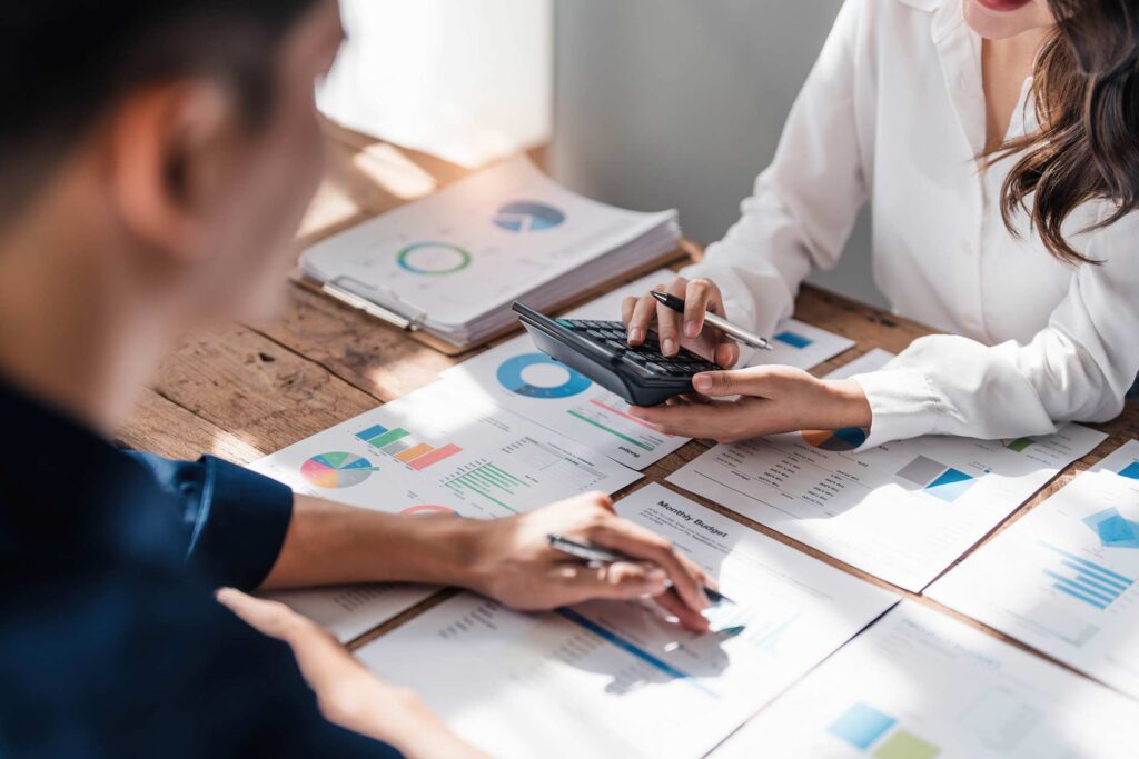 Two business people talk project strategy at office meeting room