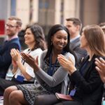 Audience Applauding Speaker After Conference Presentation