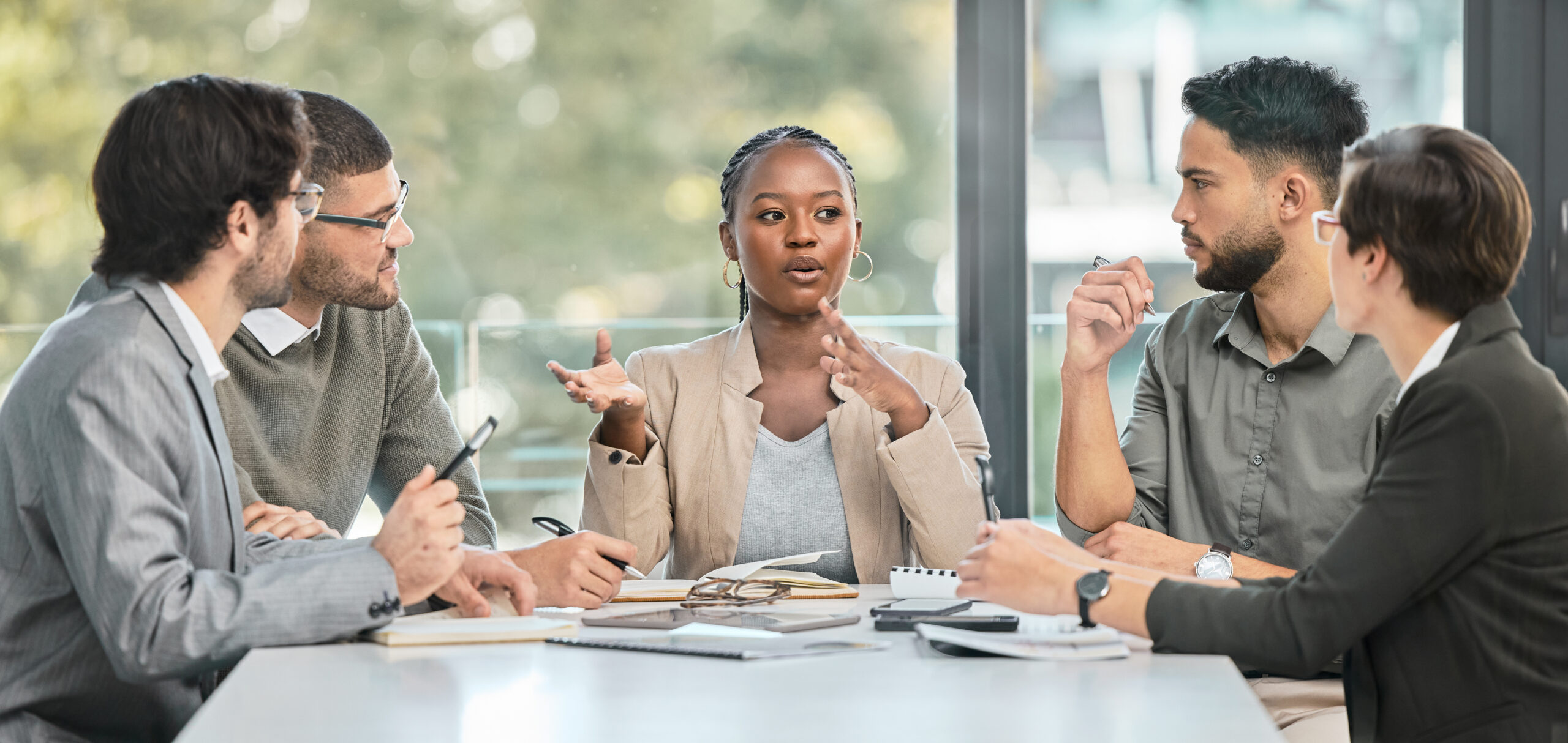 Business meeting, conversation and company strategy with diversity and communication. Corporate, management conversation and planning of a training team in workshop with teamwork and collaboration