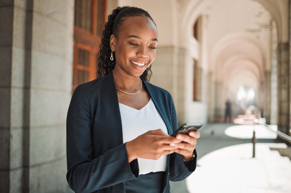 Woman in the city looking at mobile phone