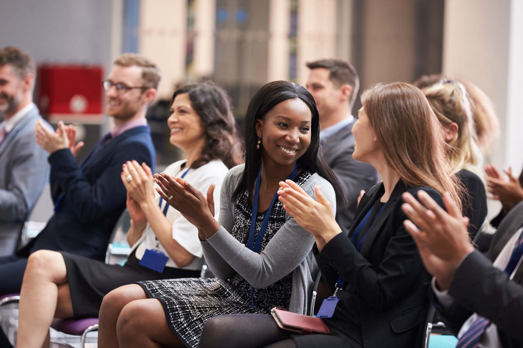 Audience Applauding Speaker After Conference Presentation