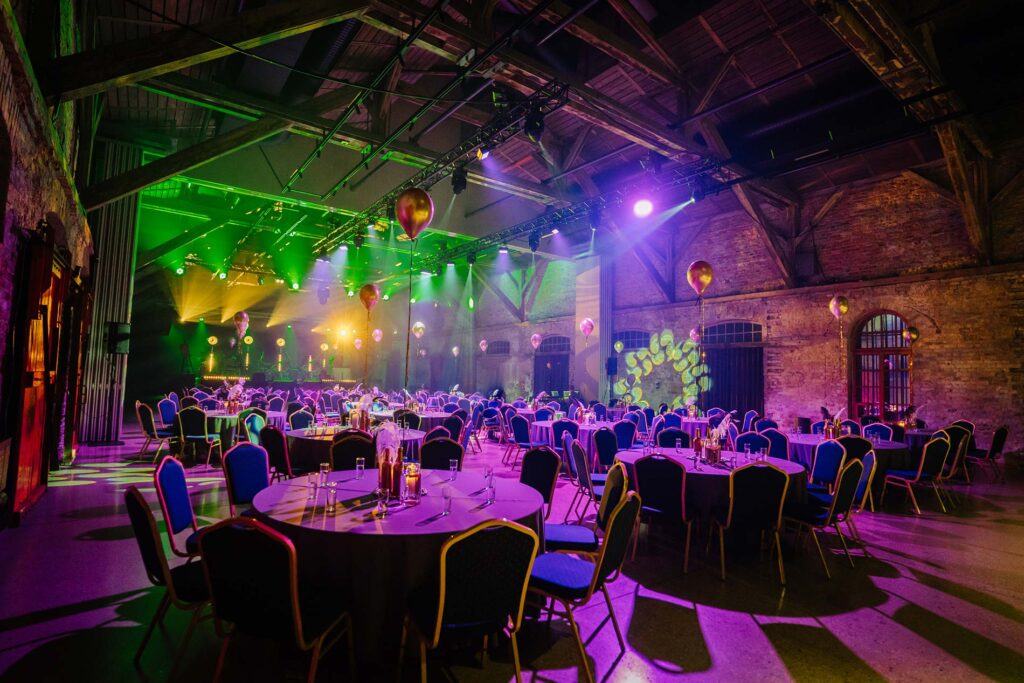 Evening dinner party event with stage lighting
