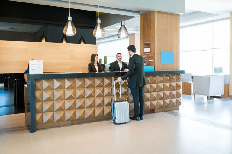 Business traveler checking in at hotel