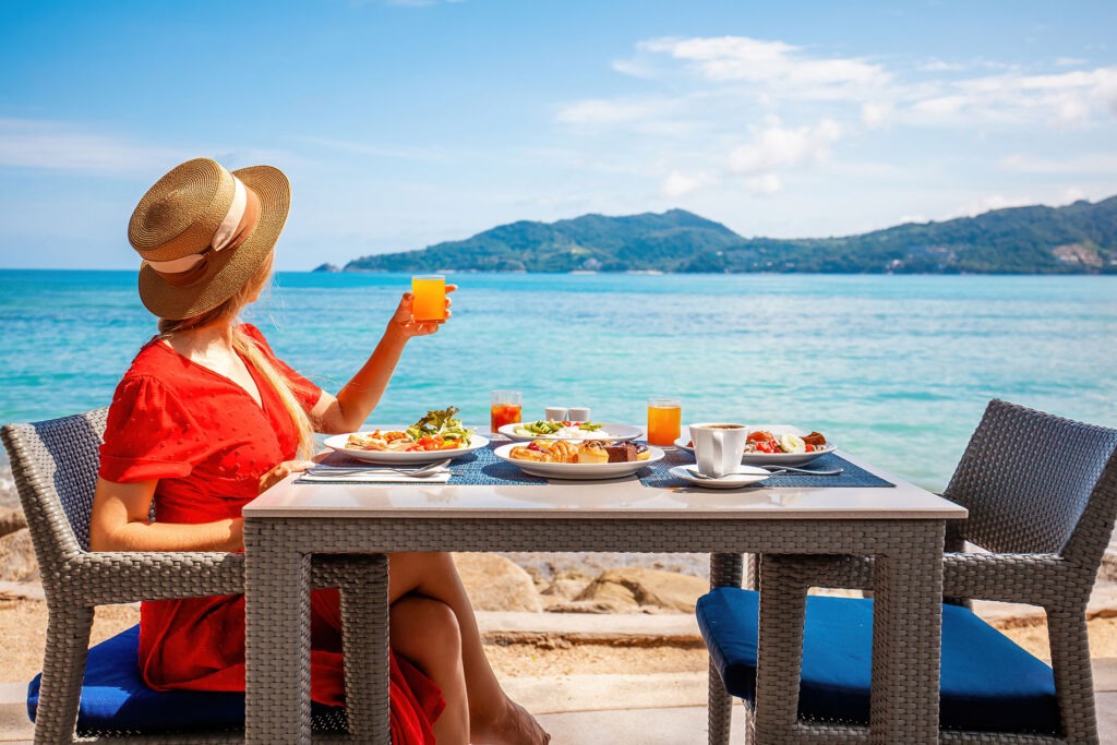 Individual eating breakfast on the beach in beautiful tropical location