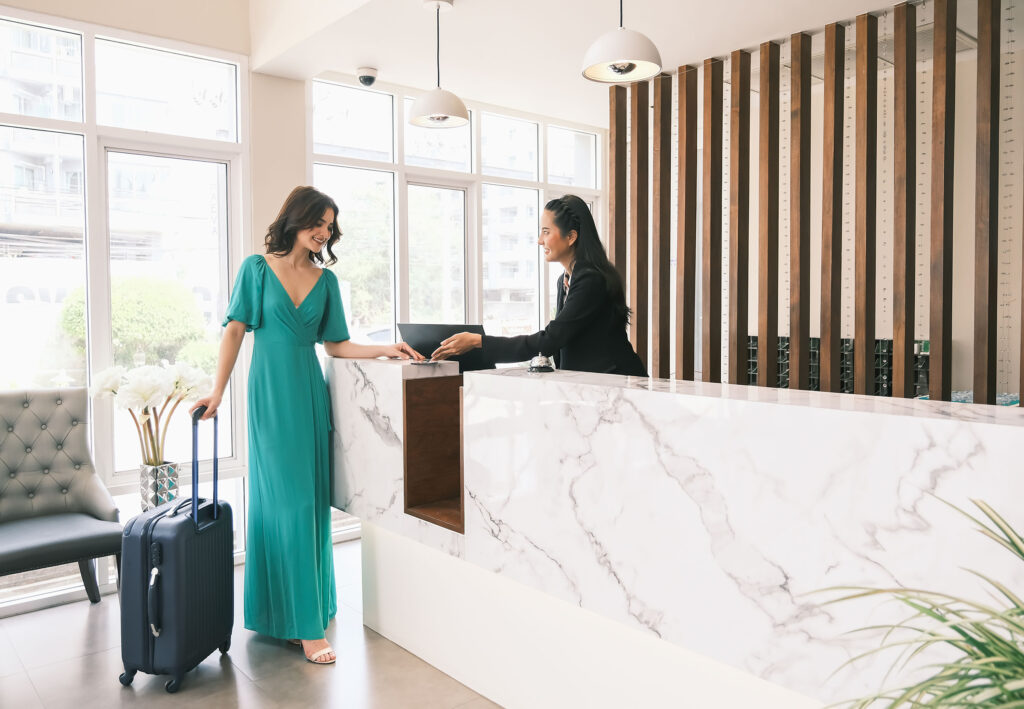 Woman checking into hotel