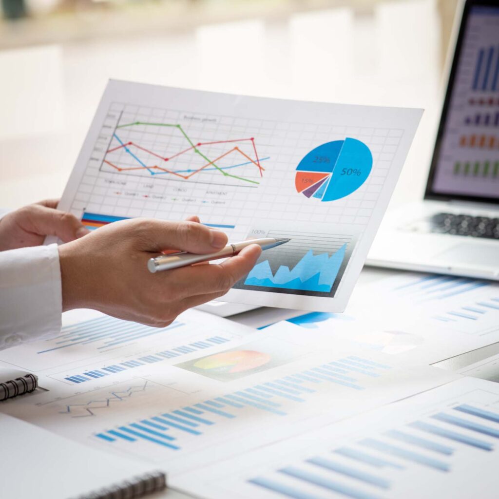Financial Business man analyze the graph of the company's perfor
