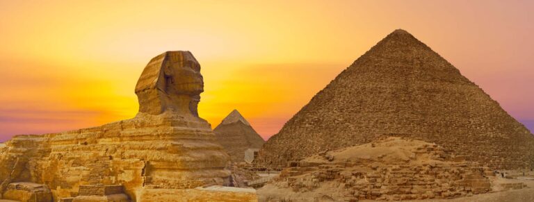 Sphinx against the backdrop of the great Egyptian pyramids.
