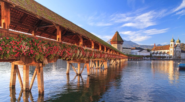Lucerne, Switzerland, early morning. The Chapel Bridge and the Jesuit Church.