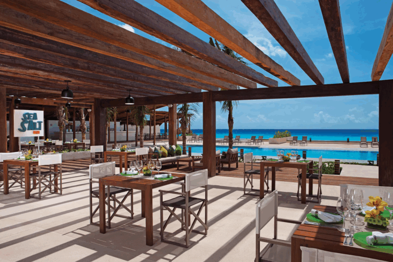 open air grill restaurant next to a pool