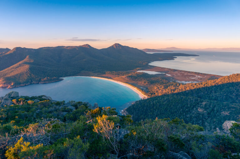 Sunrise nature landscape of beautiful ocean bay, lagoon and mountains. Wineglass bay in Tasmania, Australia