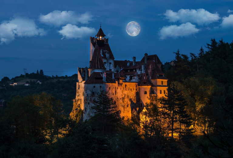 Dracula's medieval castle at night with full moon - Bran , Transylvania. Romania.