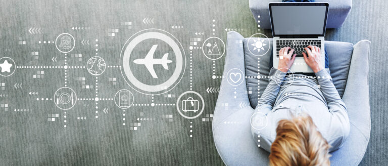 Airplane travel theme with man using a laptop